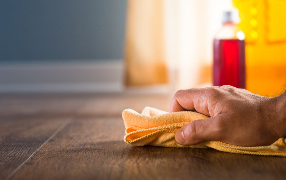 Male,Hand,Applying,Wood,Care,Products,And,Cleaners,On,Hardwood